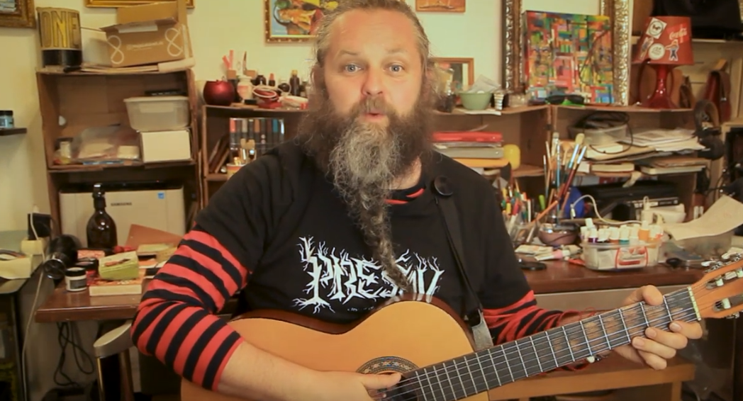 Hudobník I am PiTa s gitarou hrá pieseň pusa z usa.